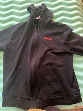 Oakley Black Zip-Up Hoodie with Red Script Logo